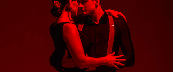 Sensual Couple Of Dancers Performing Tango On Dark Background With Red Illumination Escort Dance Madrid